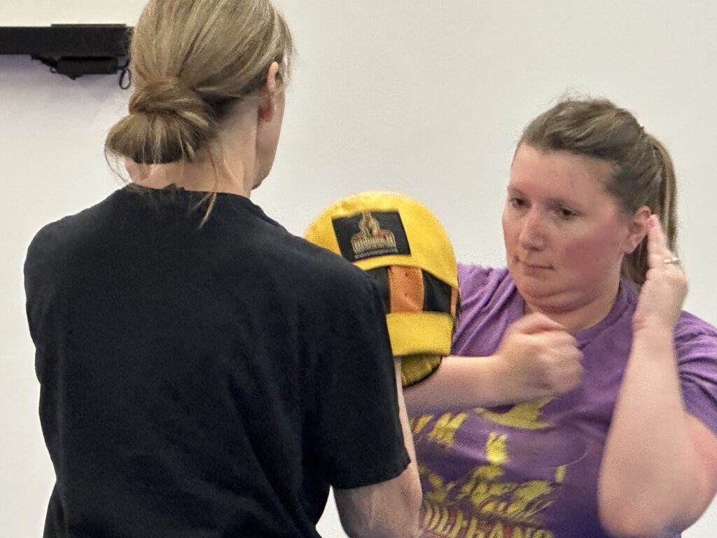Adults practicing real-world self defense training at Empire Defense & Fitness in Albany NY