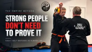 Adult self-defense students practicing controlled partner drills at Empire Defense & Fitness in Albany, NY.