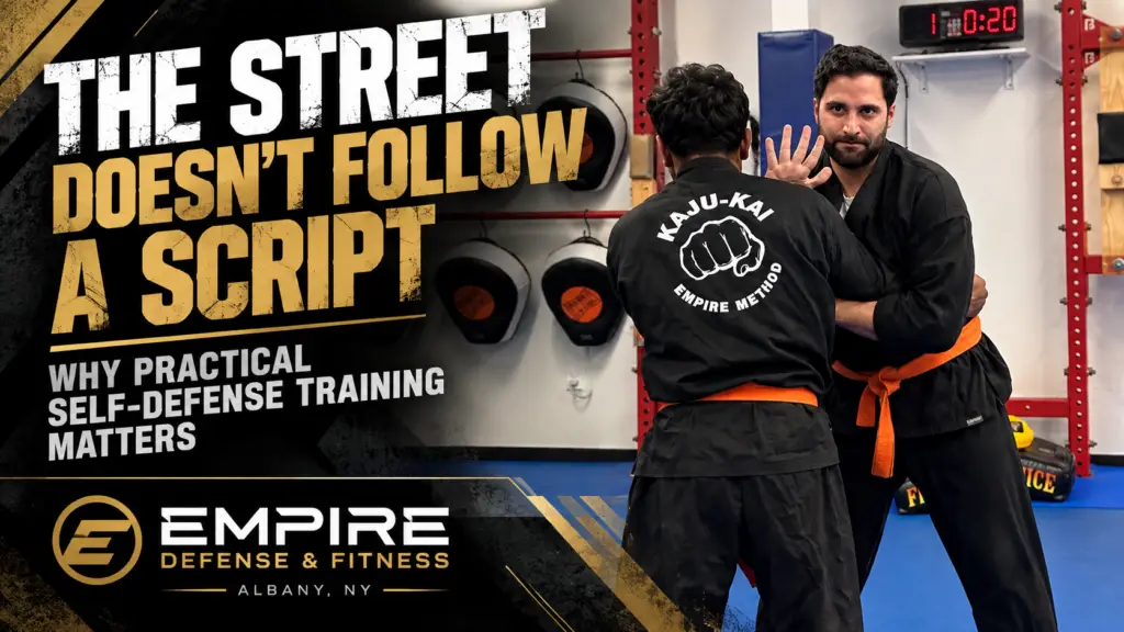 Adult self-defense students practicing realistic training at Empire Defense & Fitness in Albany NY